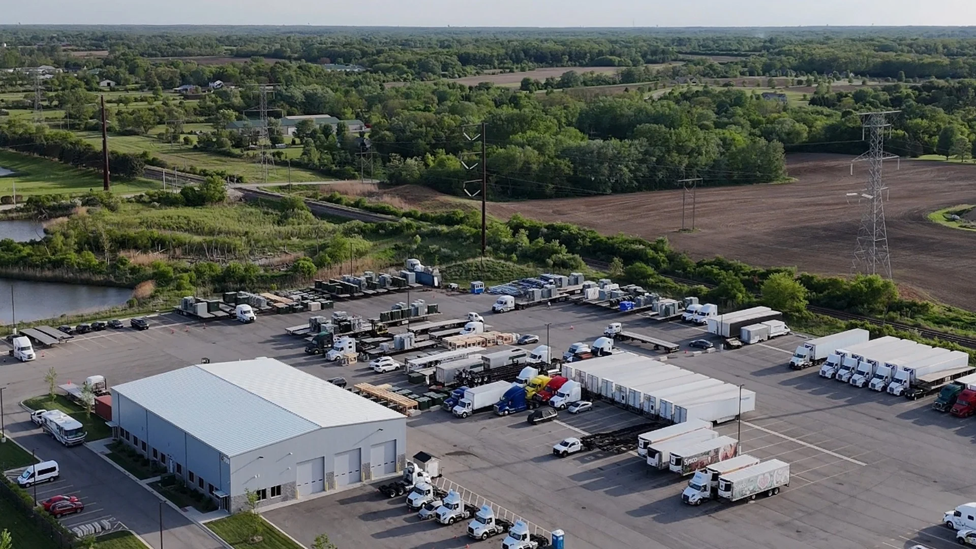 Aerial view of the All-In CDL Zion training yard with a semi-truck and cones